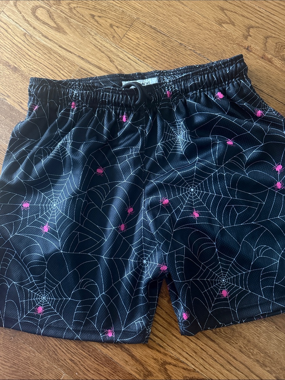 Kids Black Spiderweb Print Athletic Shorts with Pink Accents